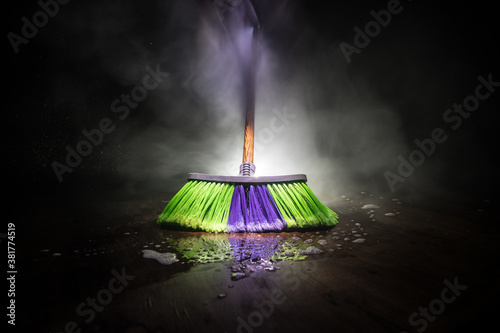 Fotomural close-up brush the floor on a dark background with light and fog
