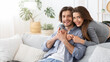 © Prostock-studio - Loving young couple embracing at home, spending time together
