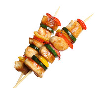 Delicious Chicken Shish Kebabs With Vegetables On White Background