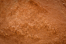 Top View Cracked Red Soil. Picture Of Natural Disaster. Drought Land, Global Warming And Deforestation. Image Of Brown Soil Texture, Close Up. Desert Realistic Background.