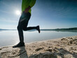 © rdonar - Man athlete running on the lake coast. Healthy and active lifestyle, sport concept. Slim body