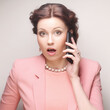 © Raisa Kanareva - funny businesswoman with mobile phone