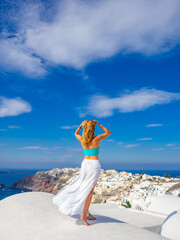 Canvas Print - Woman on holidays in Santorini island