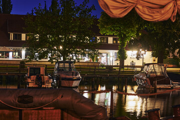 Sticker - GREIFSWALD, GERMANY - Aug 30, 2020: View of the Greifswald sailing harbor at the blue hour.