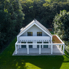 Canvas Print - House in forest, drone view