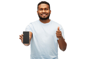 technology and people concept - happy young african american man with smartphone showing thumbs up over white background