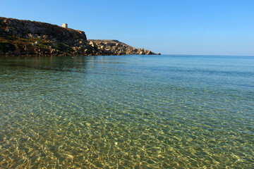 Golden bay beach on Malta island with calm transparent sea water