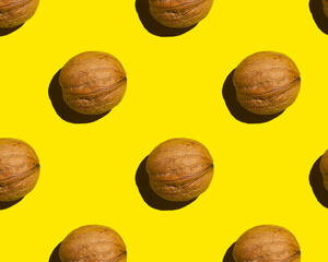 Poster - walnut on yellow background, pattern