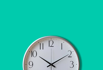 Wall Mural - Close-up of Analog vintage white clock isolated on mint green wall background. Time management concept. with copy space.