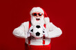 © deagreez - Portrait of his he attractive cheerful cheery glad fat white-haired Santa holding in hands throwing soccer ball hobby isolated bright vivid shine vibrant red burgundy maroon color background