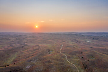 Wall Mural - hazy sunrise over Nebraska Sandhills at Nebraska National Forest, aerial view of fall scenery affected by wildfire smoke from Colorado and Wyoming