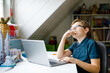 © Irina Schmidt - Kid boy with glasses learning at home on laptop for school. Adorable child making homework and using notebook and modern gadgets. Home schooling concept.