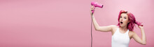 Shocked Young Woman With Colorful Hair Using Hairdryer Isolated On Pink, Panoramic Shot
