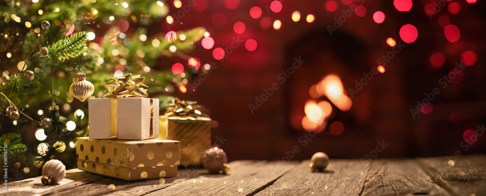 Christmas Tree with Decorations Near a Fireplace with Lights - obrazy, fototapety, plakaty 