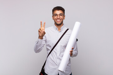 Wall Mural - young architect man smiling and looking friendly, showing number two or second with hand forward, counting down