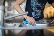 © Paul Bradbury/Caia Image - Close up woman disinfecting sink