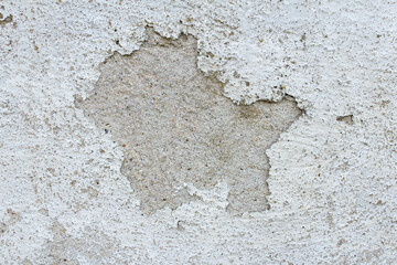 Wall Mural - Peeling paint in the middle of a chipping white wall. Retro and vintage abstract background.