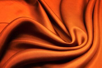 Colorful orange silk satin texture background, red cotton fabric cloth texture