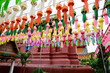Colorful paper lanterns Lanna style hanging for worship or respect of buddha in Wat Phra That Hariphunchai, northern of Thailand