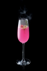 Sticker - Pink cocktail with smoke on the black background