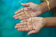 Closeup of children wrinkled wet hands