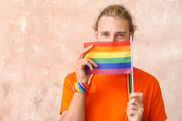 Sticker - Young man with LGBT flag on color background