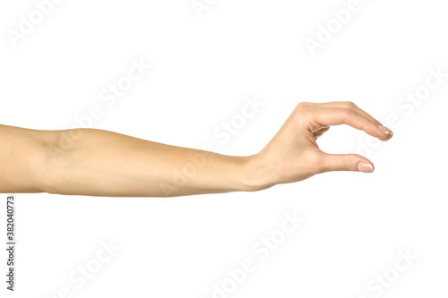 Fotomural Measuring invisible item. Woman hand gesturing isolated on white