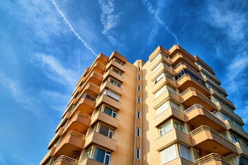 Modern and new apartment building and blue sky background