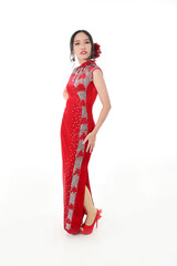 Wall Mural - South east Asian Chinese race ethnic origin woman wearing red velvet cheongsam with hand stitched sequence work dress costume on white background