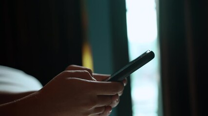 Poster - Man using smartphone in the living room at home, Hand typing message