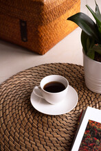 A Cup Of Coffee, Green Plant On The Table. Coffee  Time. Boho Style.