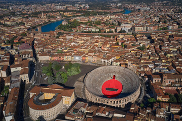 Wall Mural - Aerial view of Arena di Verona, Italy. The Arena at Piazza Brà in Verona, is a famous Roman amphitheater. Photographing with drone. Verona, northern Italy. Flying over the historic city center.