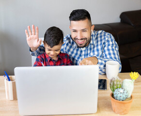 father and son make video call with quarantined relatives