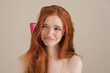 Photo of redhead shirtless girl with comb in her hair crying on camera