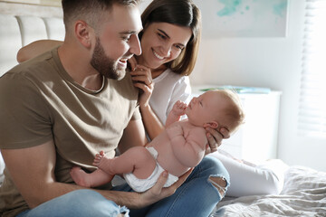 Sticker - Happy couple with their newborn baby at home