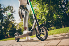 Cropped View Of Her She Teenage Teen Trendy Skinny Slim Fit Hipster Girl's Legs Riding Kick Scooter Spending Free Time Sunny Day Having Fun Activity Sport In Forest Wood Outdoor Youth Hobby