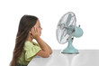 © New Africa - Little girl enjoying air flow from fan on white background. Summer heat