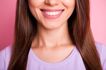 Wall Mural - Closeup cropped photo of beautiful woman with brunette hair smiling with white teeth isolated on pastel pink color background