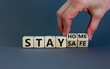 © Dzmitry - Wooden cubes form the expression 'stay home, stay safe'. Beautiful grey background, copy space. Covid19 pandemic concept.