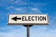 Election road sign, arrow on blue sky background. One way blank road sign with copy space. Arrow on a pole pointing in one direction.