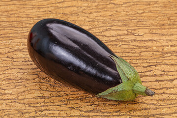 Black ripe fresh eggplant over background