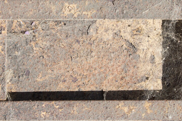 Wall Mural - Stone brick, cardboard, and an abandoned piece of wood full of dirt and cobwebs from the passage of time. Abstract texture background. Copy space.