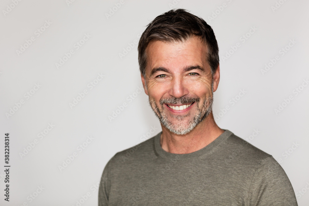 Portrait Of A Mature Man Smiling At The Camera. Right side of the ...