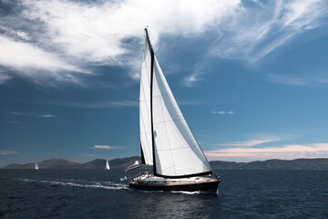 Wall Mural - Luxury sailing. Sailboat in the regatta in the Aegean Sea.