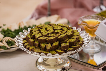 Close up view of silver plate with oriental (Persian) sweets (baklava) at the beach wedding, Punta Cana, Dominican Republic 