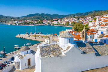 view of town and port at the island skopelos, northern sporades, greece