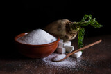 Fototapeta  - sugar beet and white sugar with rust background