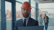 © america_stock - Facial Recognition. Face ID. Face Detection. Biometric Technological 3D Scanning of Face of Handsome Caucasian Engineer Architect Businessman at Work Wearing Hard Hat Using Laptop on Inside Building.