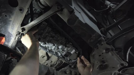 Wall Mural - CVT gearbox close up, worker hands changing oil and making maintenance in new modern variator automatic transmission on SUV in Car Service.