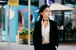 © MaaHoo Studio/Stocksy - Portrait of young woman on urban street